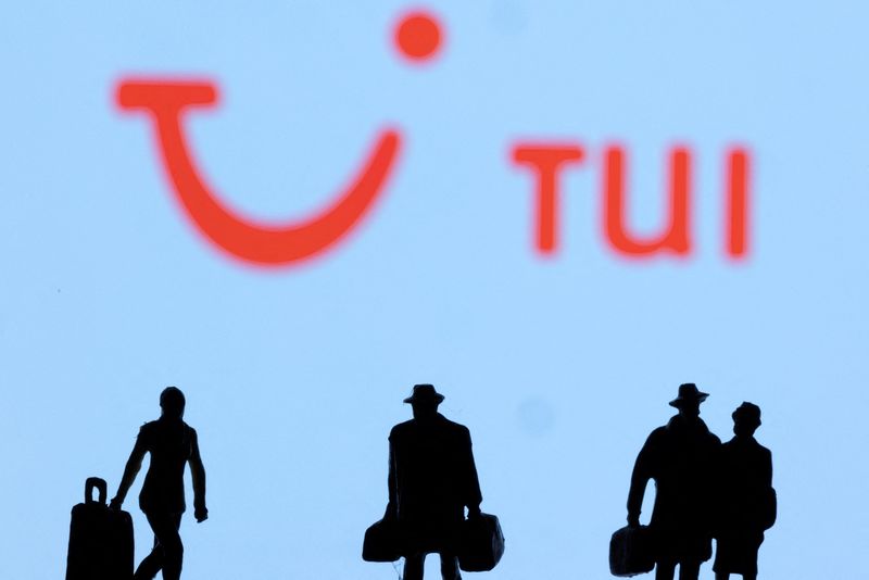 Figurines are seen in front of Tui logo