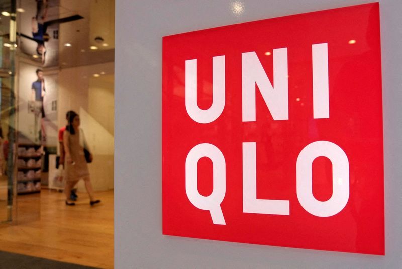 FILE PHOTO: FILE PHOTO: Shoppers walk inside Fast Retailing's Uniqlo casual clothing store in Tokyo