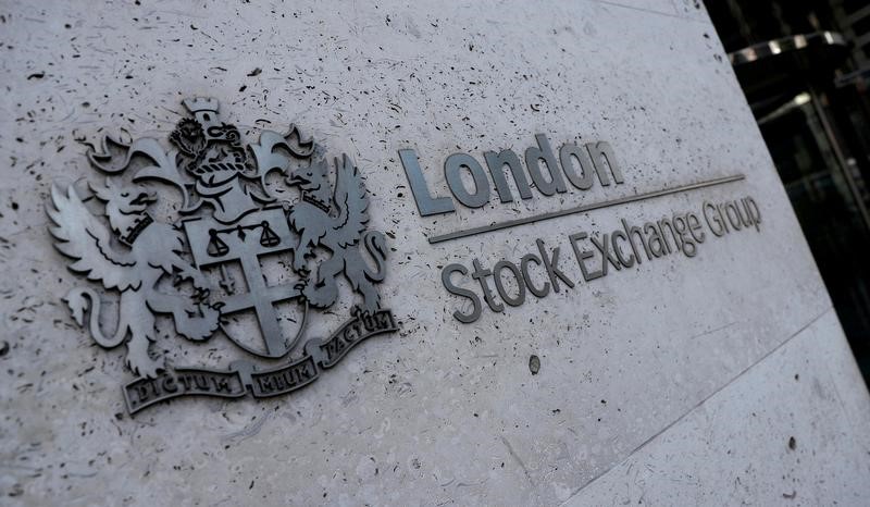 FILE PHOTO: Signage is seen outside the entrance of the London Stock Exchange in London