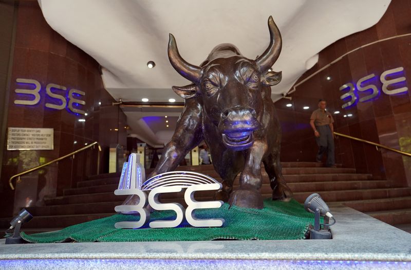 FILE PHOTO: A man walks out of the Bombay Stock Exchange building in Mumbai, India,