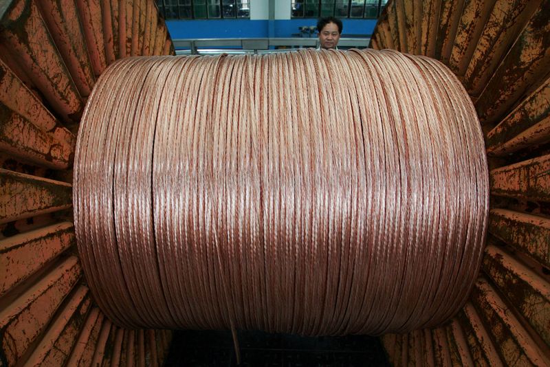 FILE PHOTO: An employee works at a electricity cable factory in Baoying