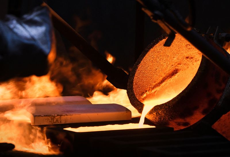 An ingot of 99.99 percent pure gold is cast at the Krastsvetmet non-ferrous metals plant in Krasnoyarsk