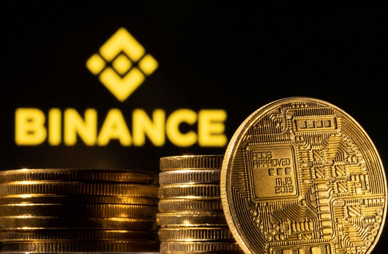 FILE PHOTO: Illustration shows a representation of the cryptocurrency and Binance logo