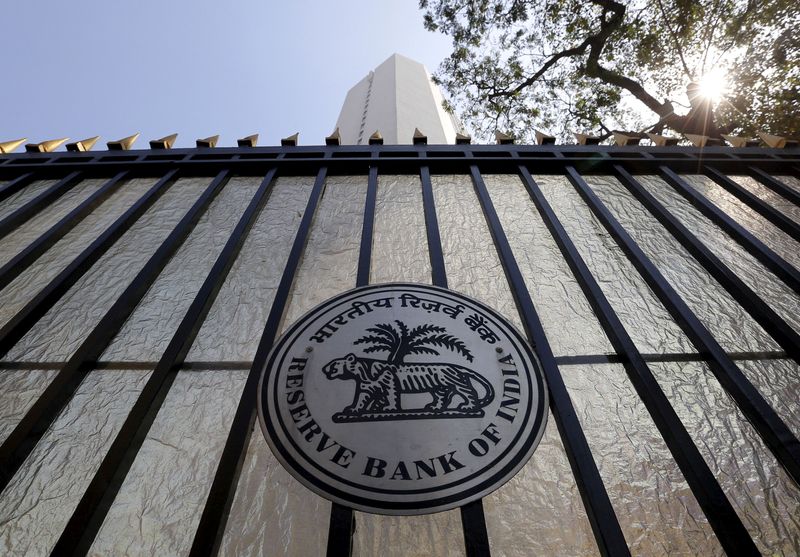 FILE PHOTO: FILE PHOTO: The Reserve Bank of India seal is pictured on a gate outside the RBI headquarters in Mumbai