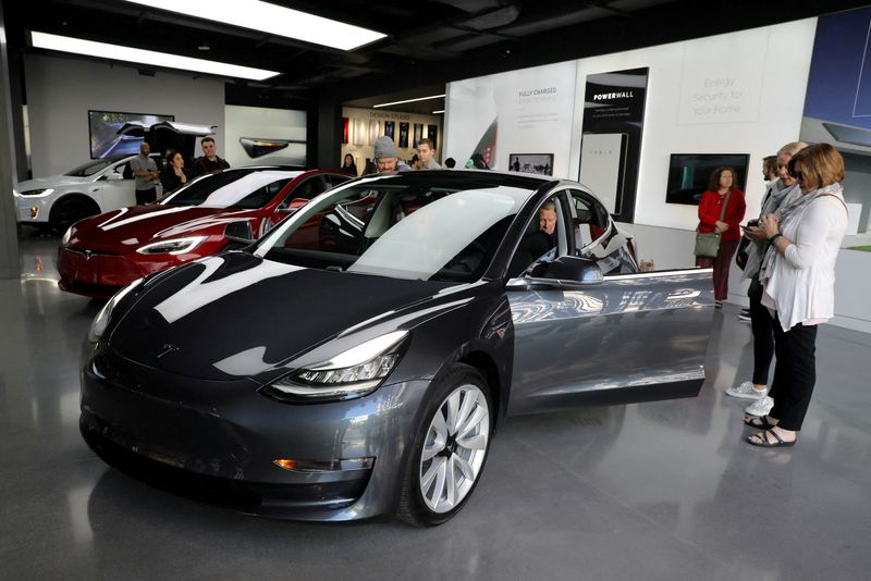 FILE PHOTO: A Tesla Model 3 is seen in a showroom in Los Angeles