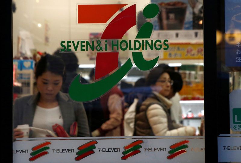 People are seen at Seven & i Holdings Co's Seven Eleven convenience store in Tokyo