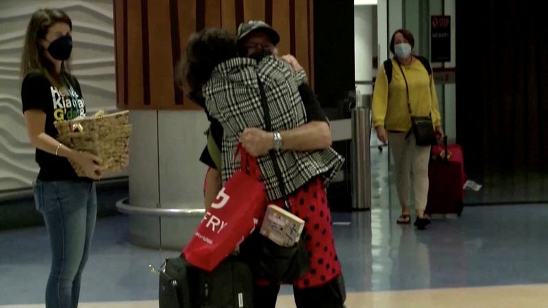 Emotional scenes at Auckland airport as New Zealand welcomes Australian visitors