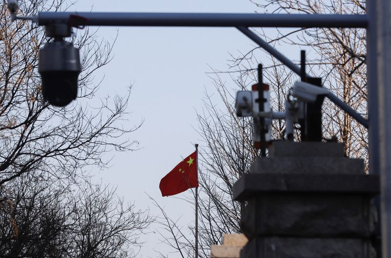 A Chinese flag is seen near surveillance cameras outside the Beijing No. 2 Intermediate People's Court, where Australian journalist Cheng Lei is expected to face trial on state secrets charges, in Beijing