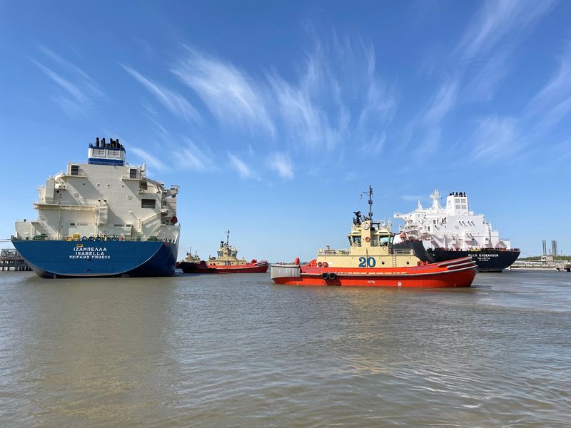 FILE PHOTO: An LNG tanker is guided by tug boats at the Cheniere Sabine Pass LNG export unit in Cameron Parish, Louisiana