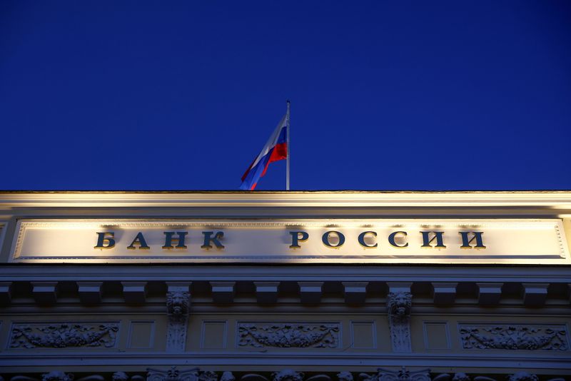 FILE PHOTO: A Russian state flag flies over the Central Bank headquarters in Moscow