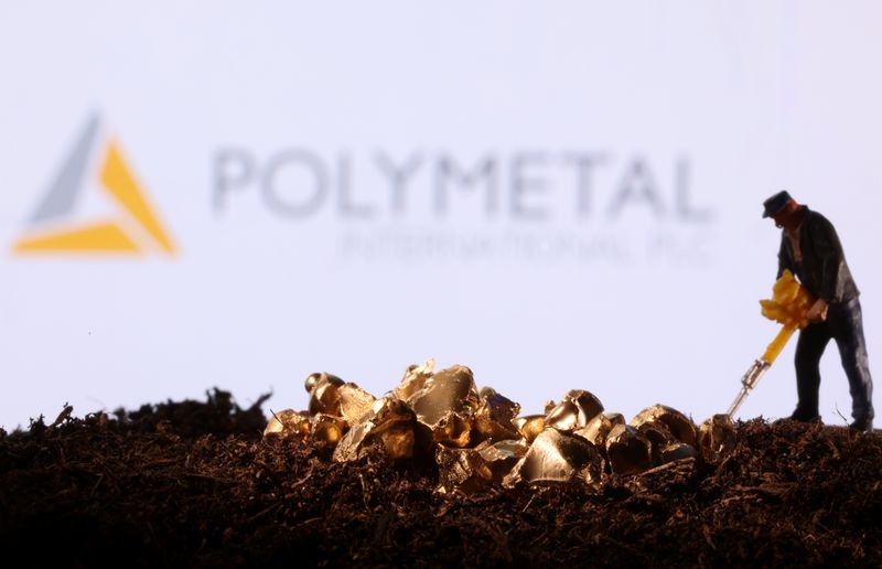 FILE PHOTO: Small toy figure and gold imitation are seen in front of the Polymetal logo in this illustration