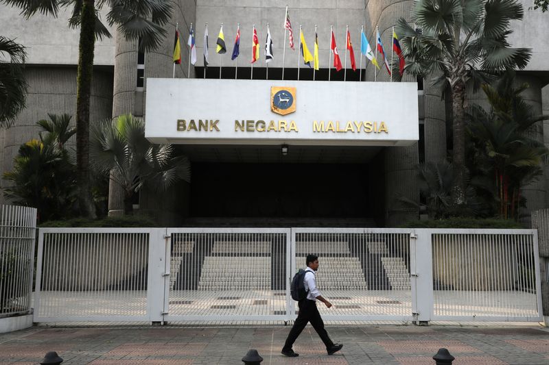 A man walks past the entrance of Central Bank of Malaysia (Bank Negara Malaysia) in Kuala Lumpur