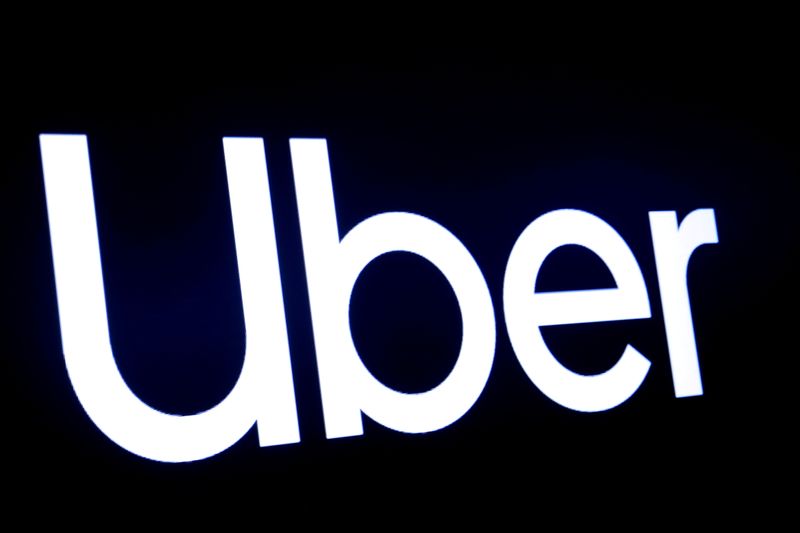 FILE PHOTO: FILE PHOTO: A screen displays the company logo for Uber Technologies Inc in 2019