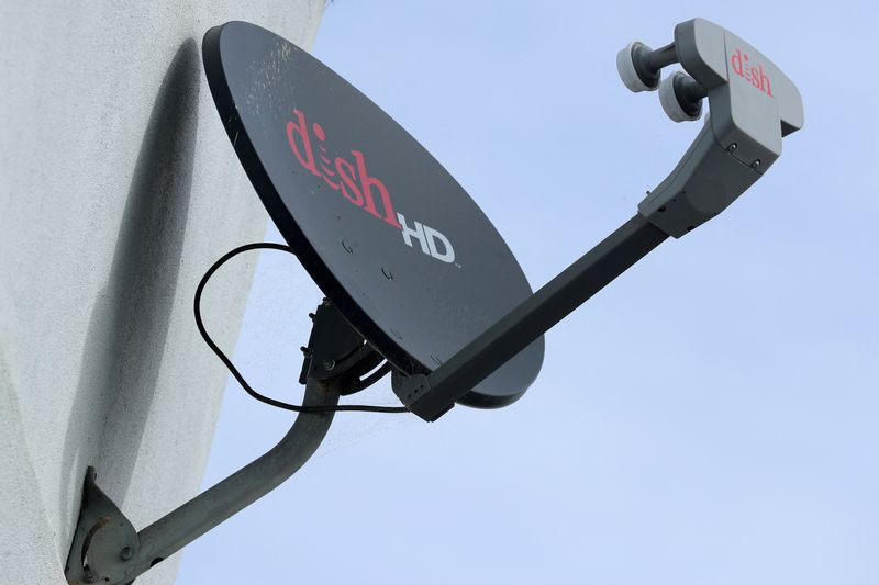 FILE PHOTO: A Dish Network satellite dish is shown on a residential home in Encinitas, California