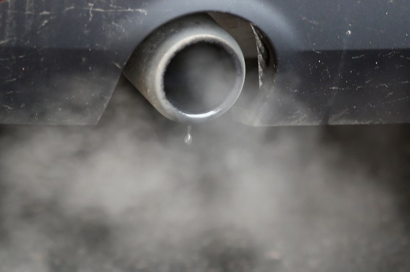 FILE PHOTO: An exhaust emits fumes as a car is driven through Richmond in London