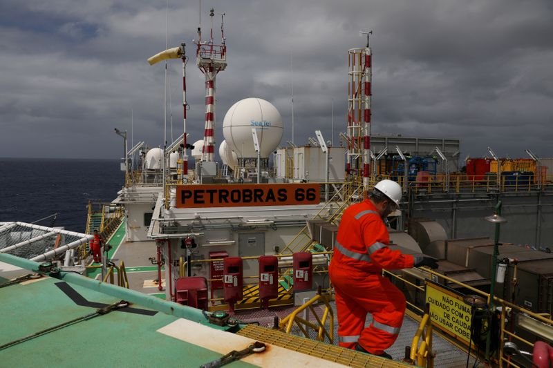 FILE PHOTO: A worker walks inside the Brazil's Petrobras P-66 oil rig in the offshore Santos Basin in Rio de Janeiro