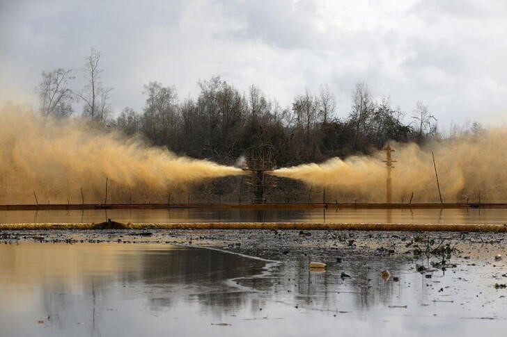 FILE PHOTO: A view of an oil spill from a well head is pictured at Santa Barbara, in Nembe, Bayelsa