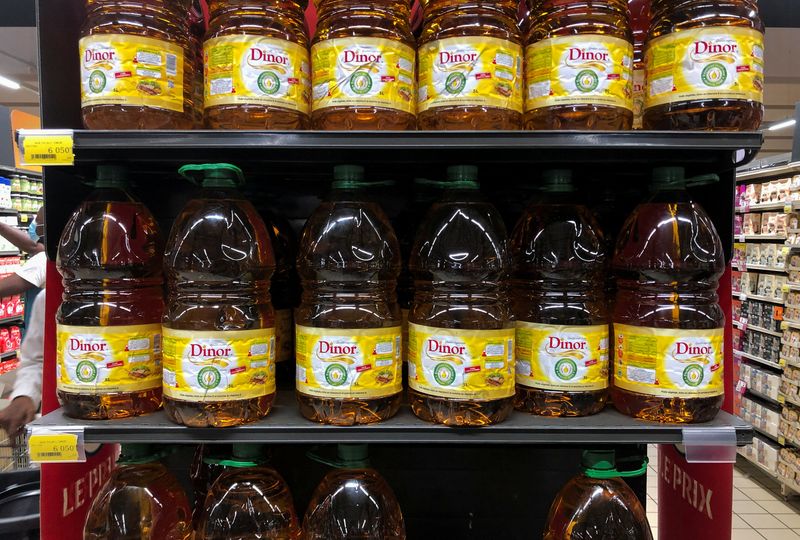 Bottles of cooking oil made from palm oil are displayed at a supermarket in Abidjan