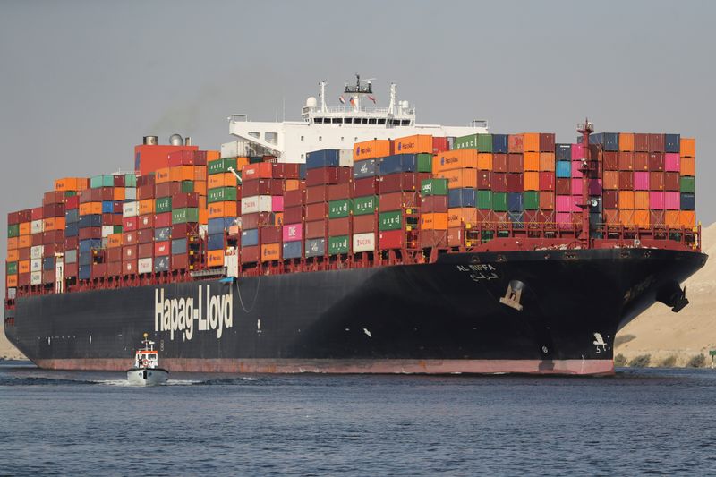 Shipping containers pass through the Suez Canal in Ismailia