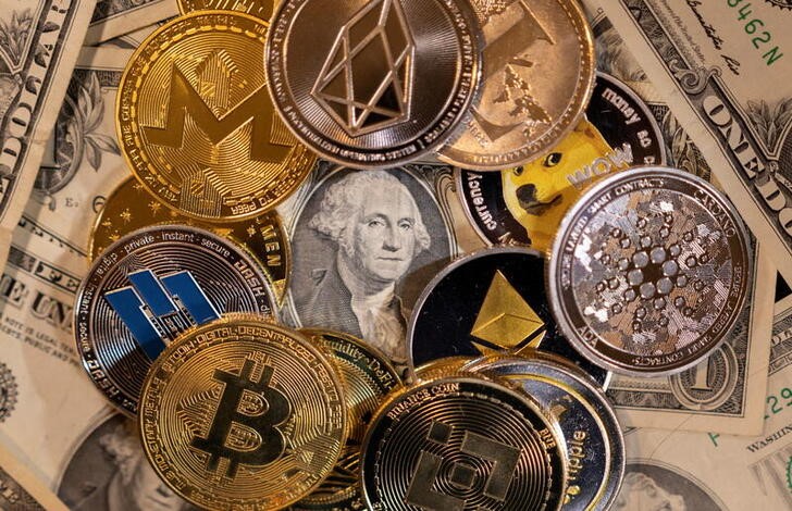 FILE PHOTO: Ilustration shows representations of virtual cryptocurrencies on U.S. dollar banknotes