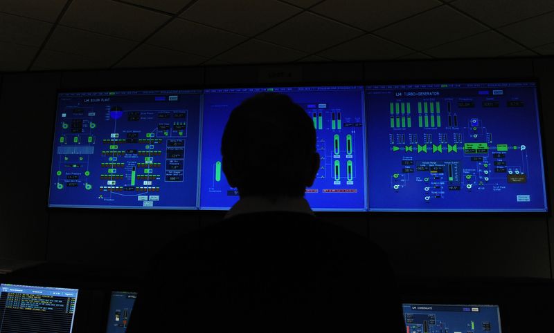 An employee works inside the control room at Drax power station in Drax
