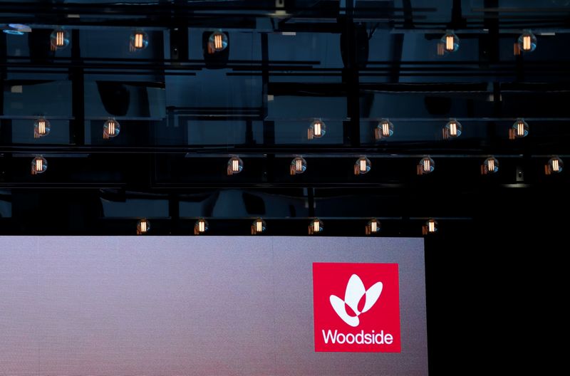 The logo for Woodside Petroleum, Australia's top independent oil and gas company, is projected onto a screen at a briefing for investors in Sydney