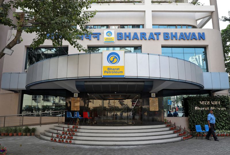 A private security guard stands in front of the regional head office of oil refiner Bharat Petroleum Corp in Kolkata