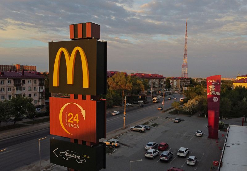 A sign with the logo is on display outside a McDonald's restaurant in Omsk