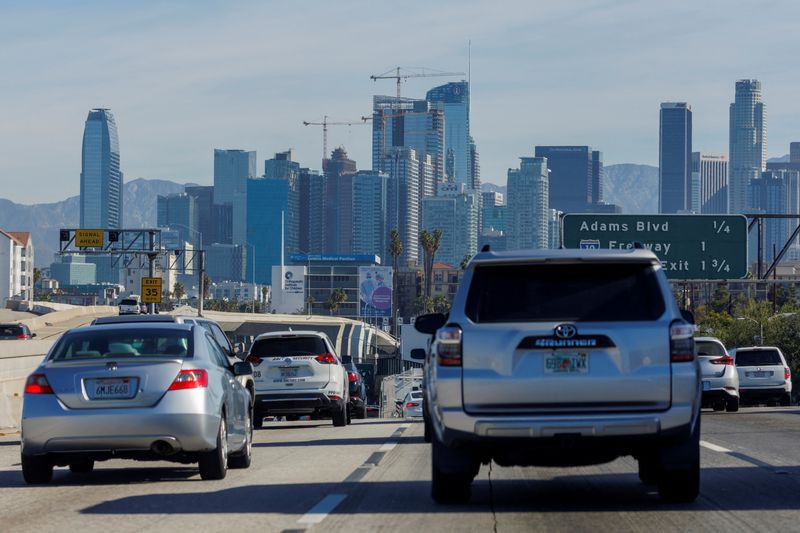 Traffic moves along a freeway as vehicles travel towards Los Angeles