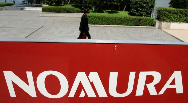 FILE PHOTO: A logo of Nomura Holdings is pictured in Tokyo