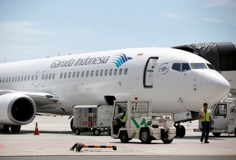 FILE PHOTO: A plane belonging to Garuda Indonesia is seen on the tarmac of Terminal 3, SoekarnoÐHatta International Airport near Jakarta, Indonesia