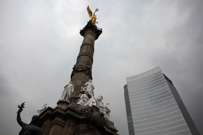 FILE PHOTO: The Angel of Independence monument stands next to British bank HSBC's headquarters in Mexico City