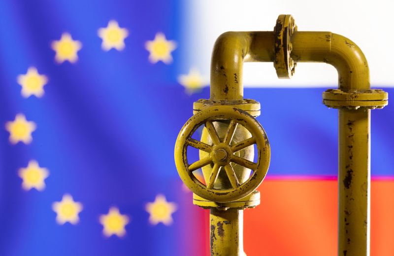 FILE PHOTO: Illustration shows natural gas pipeline in front of word EU and Russia flag colours