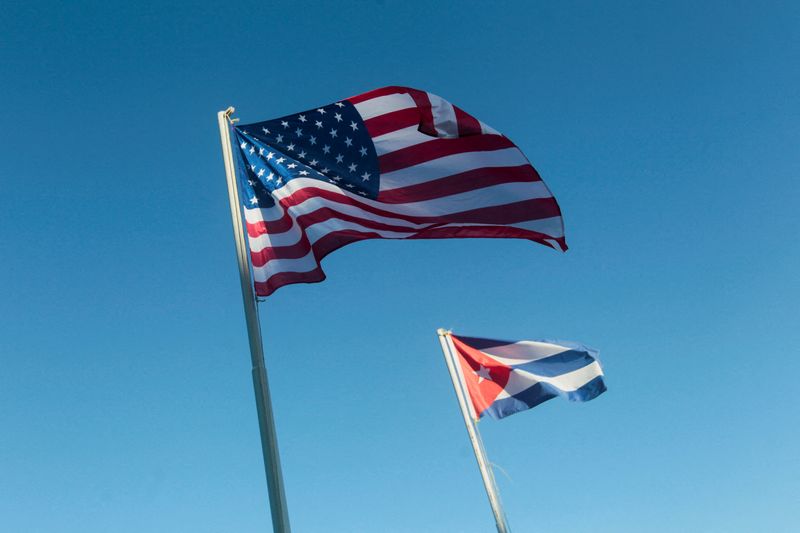 FILE PHOTO: U.S. and Cuban flags hang outside a hotel in Havana