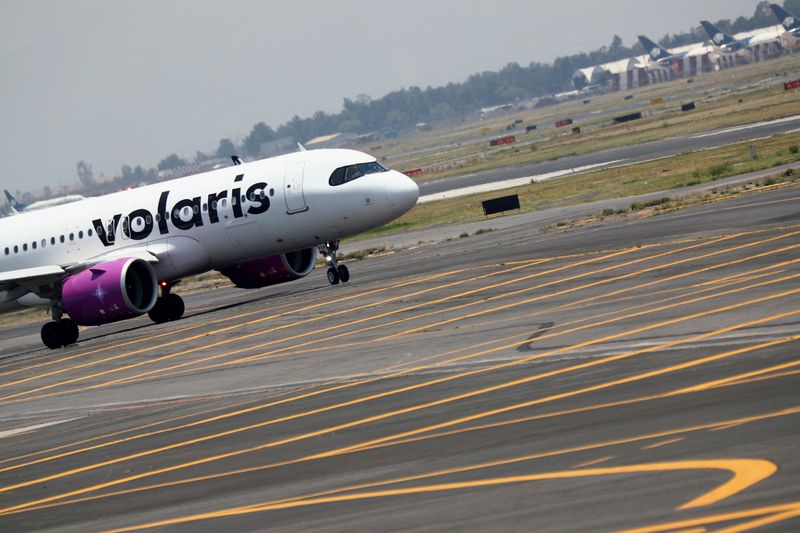 FILE PHOTO: A Volaris airplane is pictured on the airstrip at Benito Juarez international airport in Mexico City