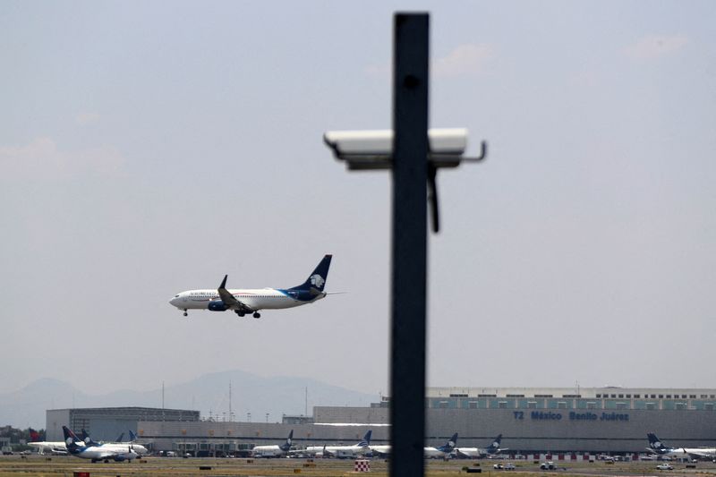 FILE PHOTO: An AeroMexico airplane prepares to land on the airstrip at Benito Juarez international airport in Mexico City