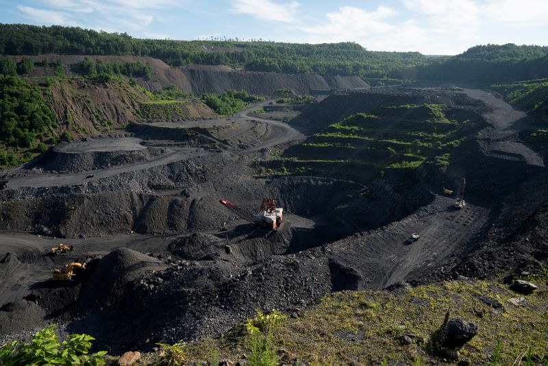 FILE PHOTO: Heavy equipment excavate anthracite coal from a strip mine in New Castle, Pennsylvania