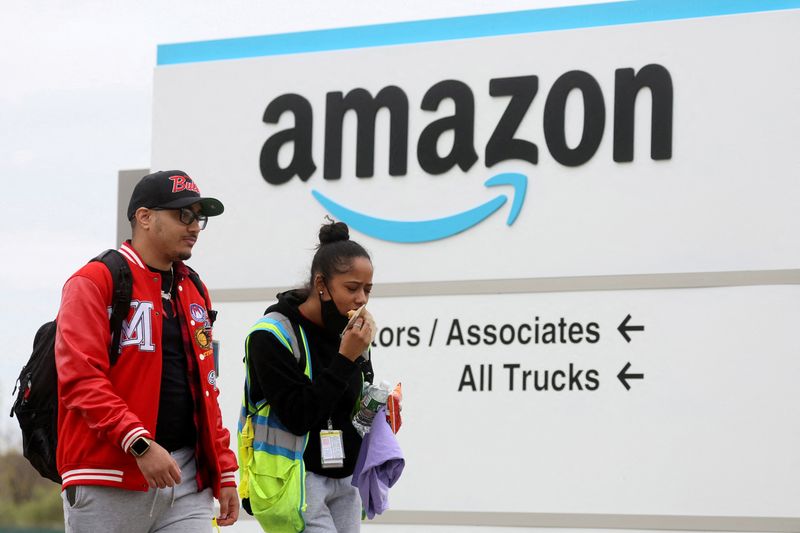 FILE PHOTO: Amazon workers walk outside Amazon’s LDJ5 sortation center in Staten Island, New York