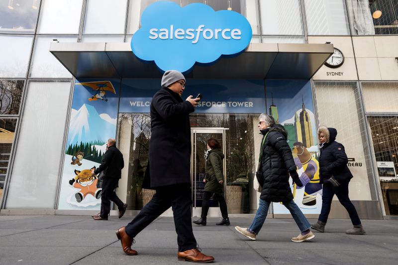 FILE PHOTO: People pass by the Salesforce Tower and Salesforce.com offices in New York