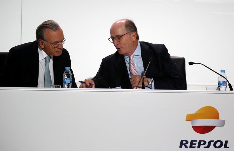 FILE PHOTO: Antonio Brufau, chairman of Spanish oil company Repsol, speaks to CaixaBank Chairman and Repsol shareholder Isidro Faine during a ceremony to present company's strategic plan in Madrid