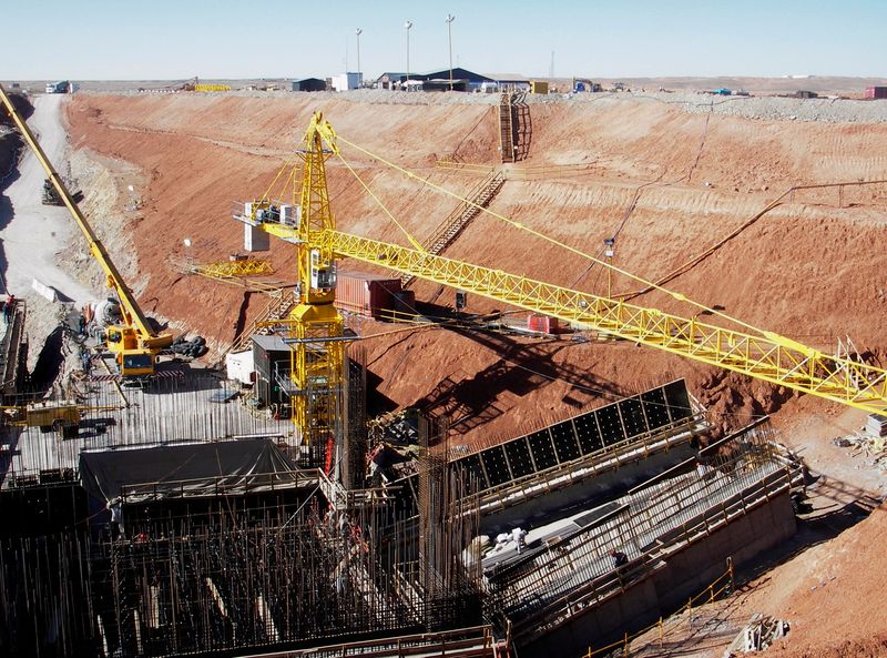 FILE PHOTO: Workers prepare the site of the second mineshaft to be sunk at Oyu Tolgoi in Mongolia