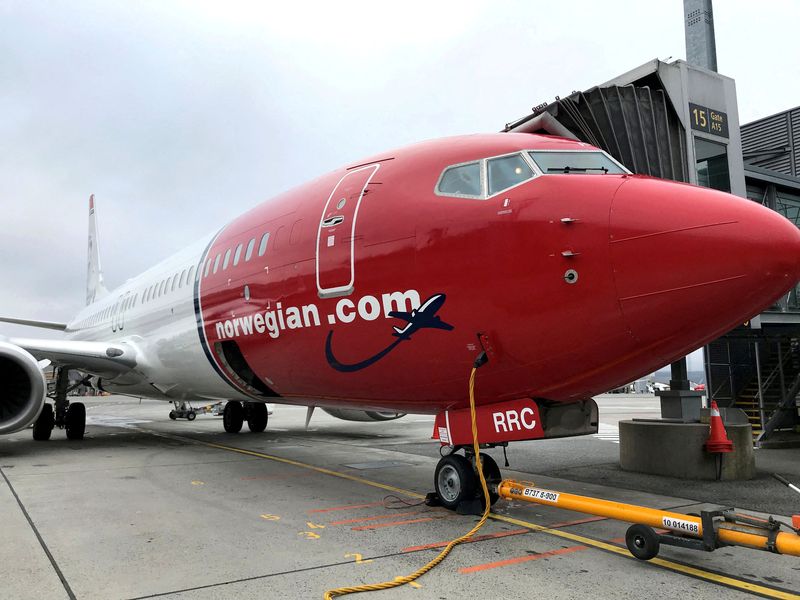 FILE PHOTO: A Norwegian Air plane is refuelled at Oslo Gardermoen airport, Norway
