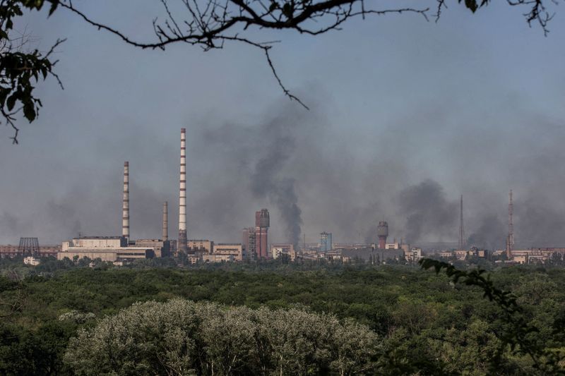 FILE PHOTO: Smoke rises after a military strike on a compound of Sievierodonetsk's Azot Chemical Plant