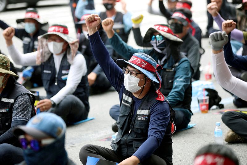 FILE PHOTO: Members of the Cargo Truckers Solidarity union take part in a protest in front of Kia Motor's factory tin Gwangju