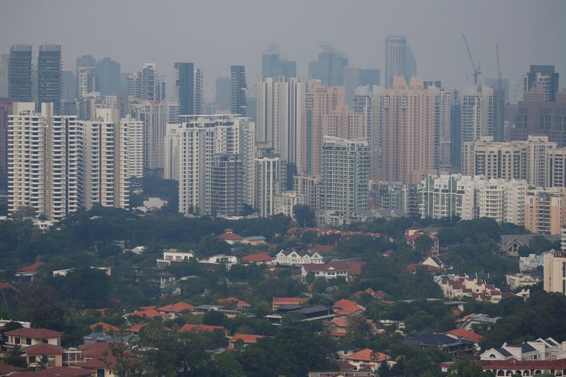 FILE PHOTO: Buildings are shrouded by haze in Singapore