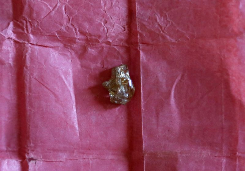FILE PHOTO: A rough diamond, from the Boda region, is displayed for sale in Bangui