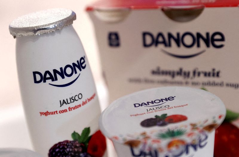 FILE PHOTO: Company logos are seen on products displayed before French food group Danone 2019 annual results presentation in Paris