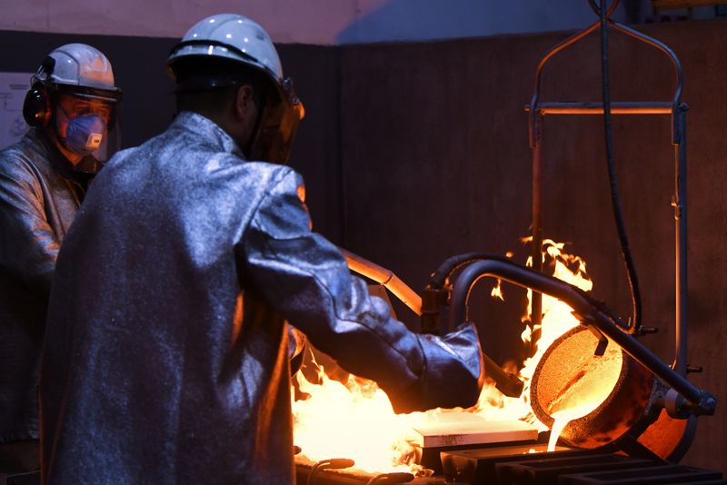 Employees cast ingots of 99.99 percent pure gold at the Krastsvetmet non-ferrous metals plant in Krasnoyarsk