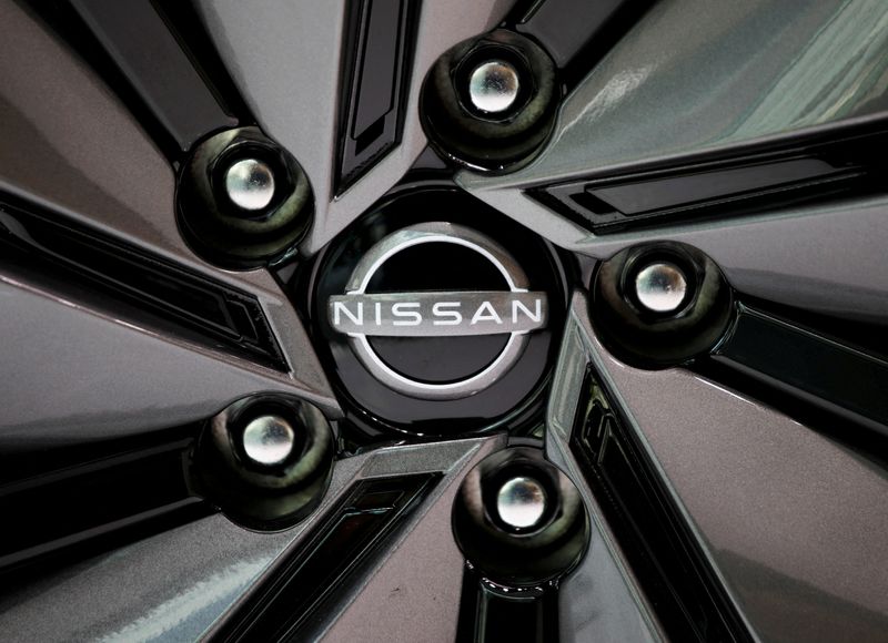 FILE PHOTO: The brand logo of Nissan Motor Corp. is seen on a tyre wheel of the company's car at their showroom in Tokyo