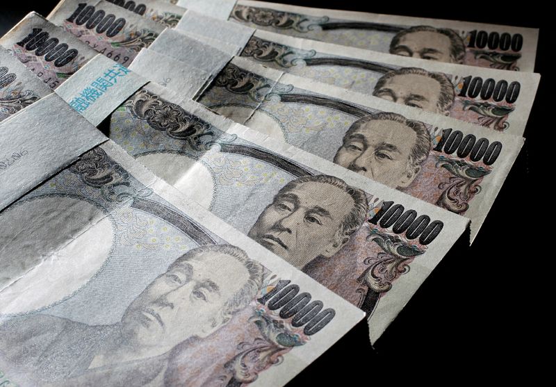 FILE PHOTO: Illustrative picture shows Japanese 10,000 yen bank notes spread out at an office of World Currency Shop in Tokyo